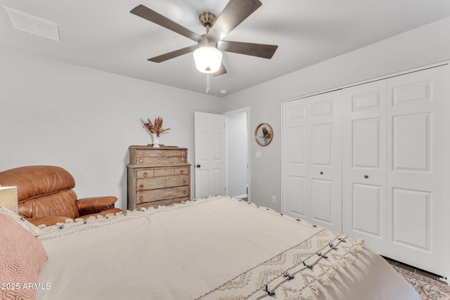 bedroom with ceiling fan and a closet