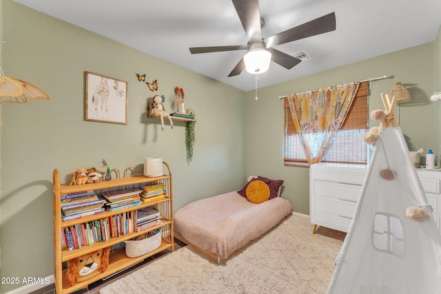 bedroom with ceiling fan and carpet flooring