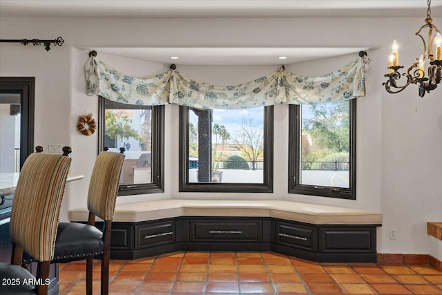 dining space with a notable chandelier