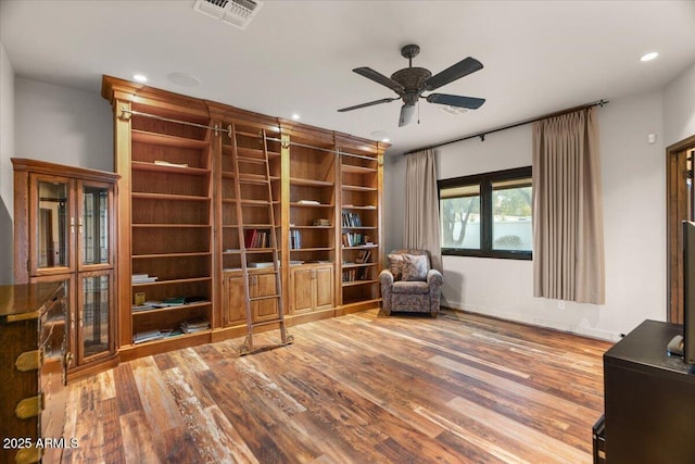 unfurnished room with visible vents, a ceiling fan, wood finished floors, recessed lighting, and baseboards