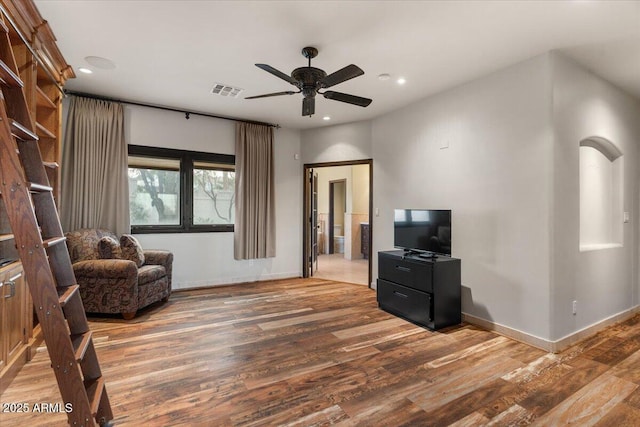 sitting room featuring recessed lighting, wood finished floors, visible vents, and baseboards