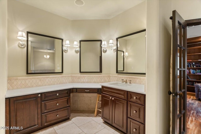 bathroom with tile patterned floors and vanity