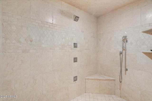 full bath with tiled shower