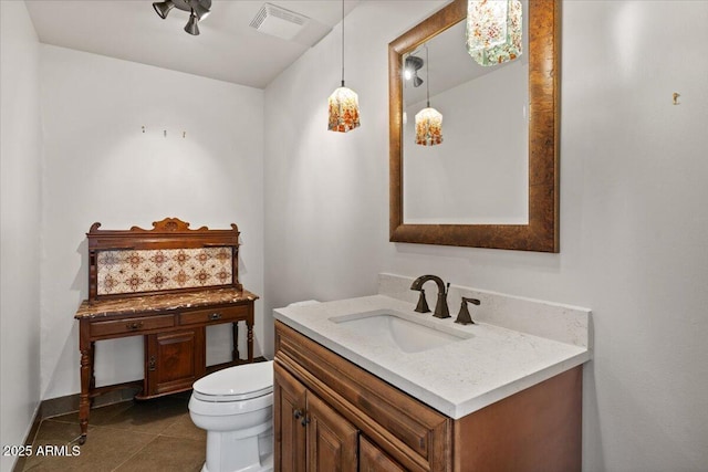 bathroom with tile patterned floors, visible vents, toilet, and vanity