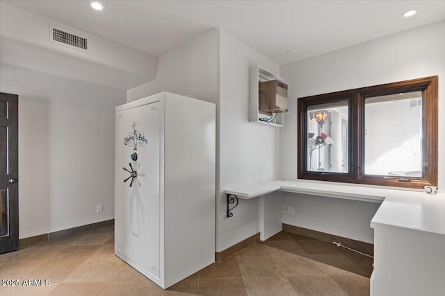 interior space featuring recessed lighting, visible vents, and baseboards