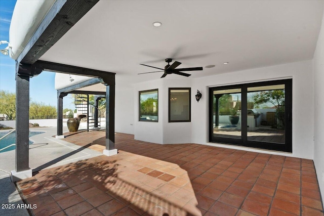 view of patio / terrace with an outdoor pool, stairs, and a ceiling fan