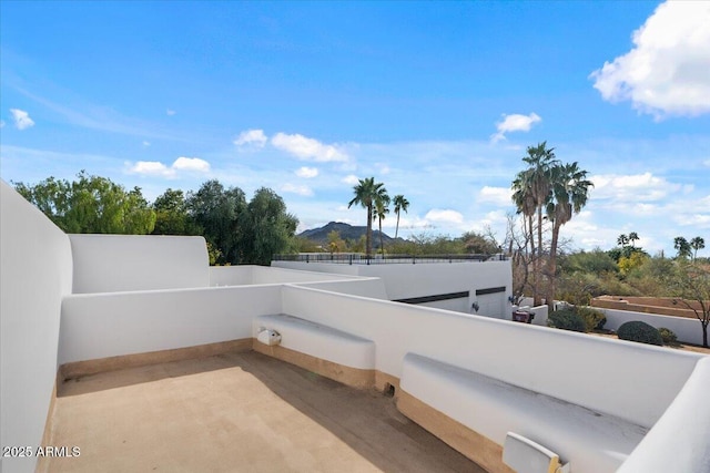 view of patio / terrace featuring a balcony and a mountain view