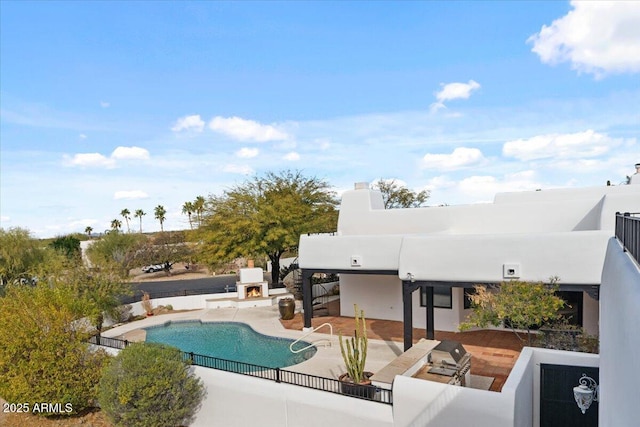 view of swimming pool with a fenced in pool and a patio