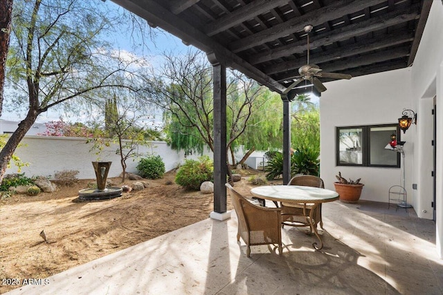 view of patio featuring ceiling fan and outdoor dining space