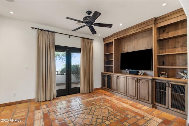 unfurnished living room with recessed lighting, french doors, baseboards, and brick floor