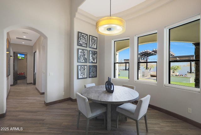 dining area with dark wood-type flooring