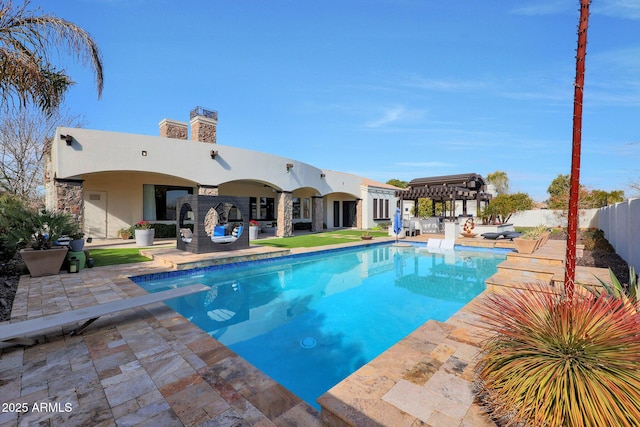 view of pool with a pergola and a patio area