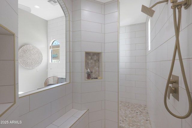 bathroom featuring tiled shower