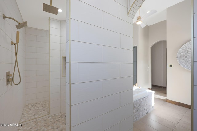 bathroom featuring a tile shower and tile patterned floors