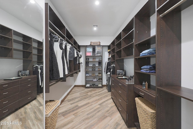 spacious closet with light wood-type flooring