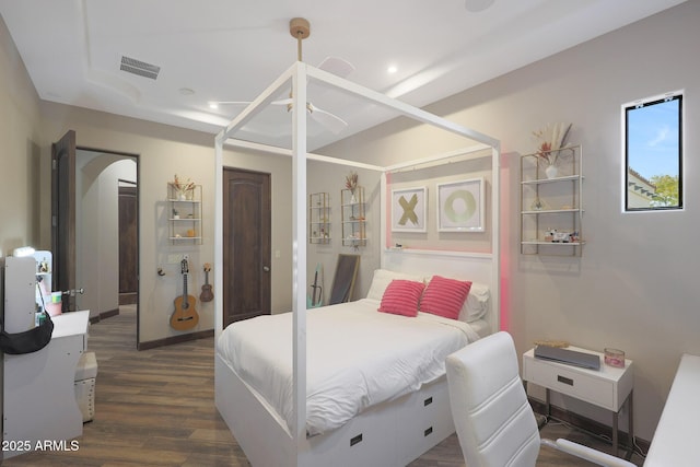 bedroom with dark wood-type flooring