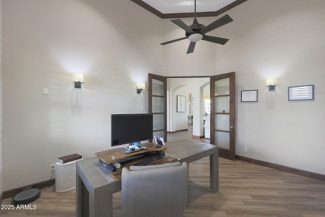 office area with ceiling fan and hardwood / wood-style floors