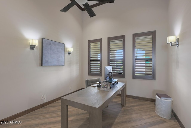 office area with ceiling fan and wood-type flooring