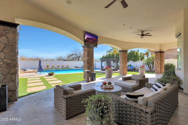 view of patio with a fenced in pool, an outdoor hangout area, and ceiling fan