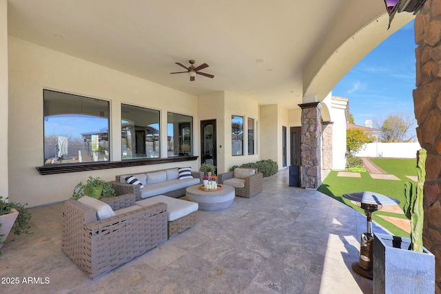 view of patio with ceiling fan and an outdoor hangout area