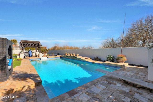 view of pool featuring a diving board and a patio area