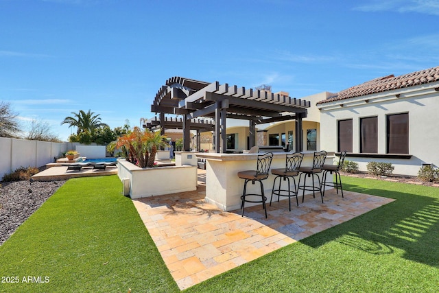 view of patio / terrace with an outdoor bar and a pergola