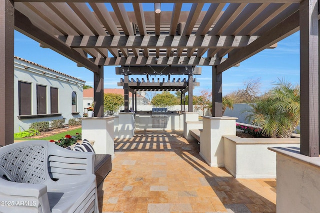 view of patio / terrace featuring an outdoor kitchen and a pergola