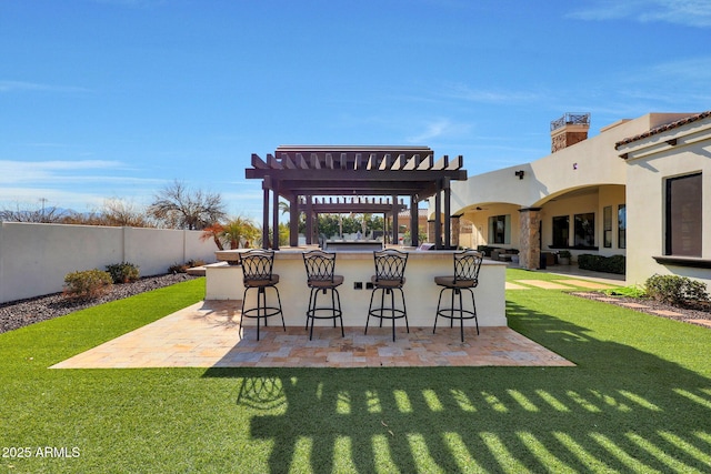 view of patio featuring a pergola and an outdoor bar