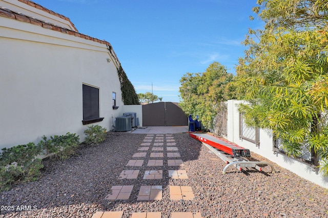 view of yard with central AC