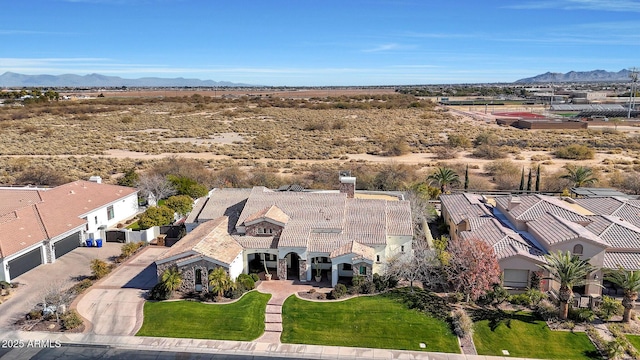 birds eye view of property with a mountain view