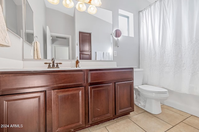 full bathroom with toilet, shower / bath combo, vanity, and tile patterned floors