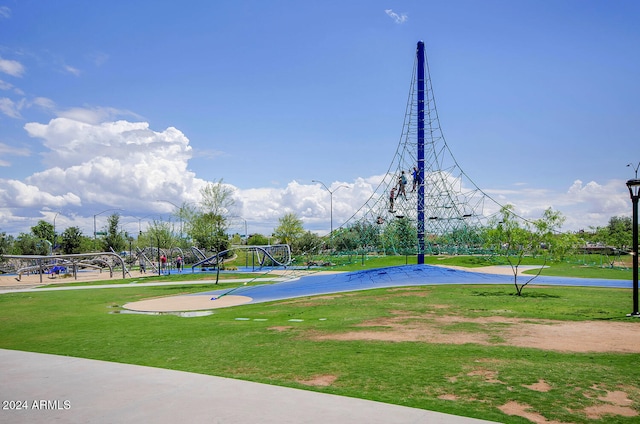 view of sport court with a playground and a lawn