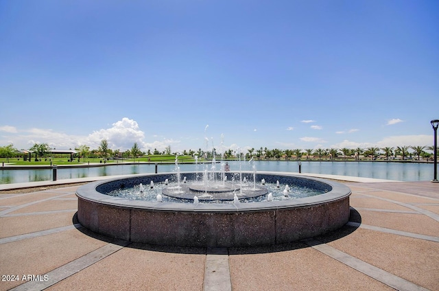 view of community with a water view