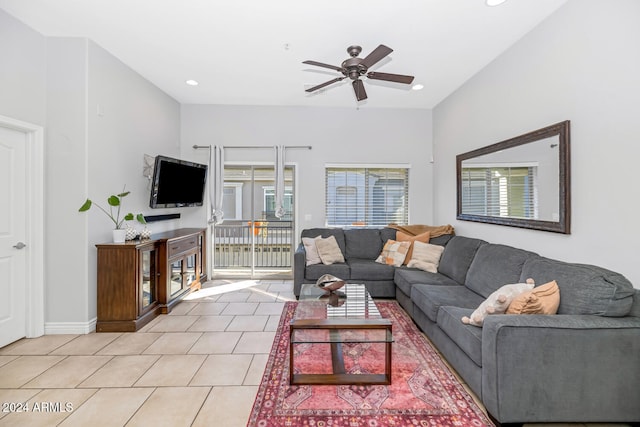 tiled living room with ceiling fan