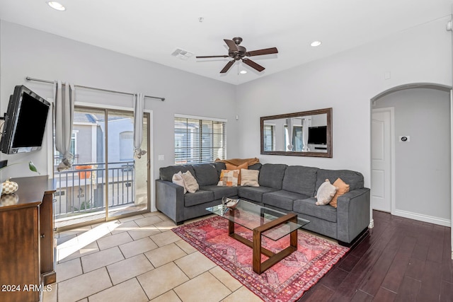 living room featuring hardwood / wood-style flooring and ceiling fan