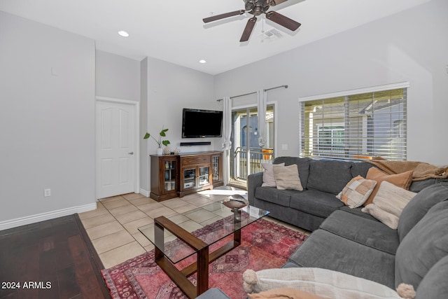 living room featuring ceiling fan and light hardwood / wood-style flooring