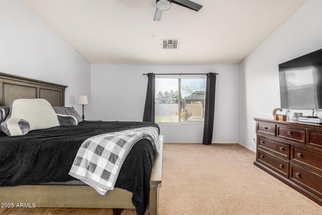 bedroom with visible vents, lofted ceiling, baseboards, light colored carpet, and ceiling fan