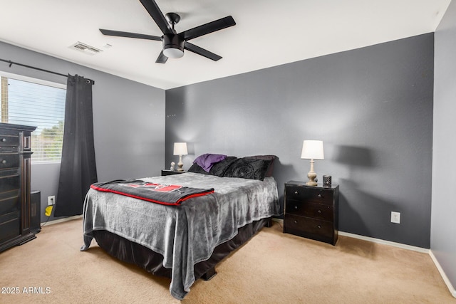 bedroom with visible vents, baseboards, a ceiling fan, and carpet flooring