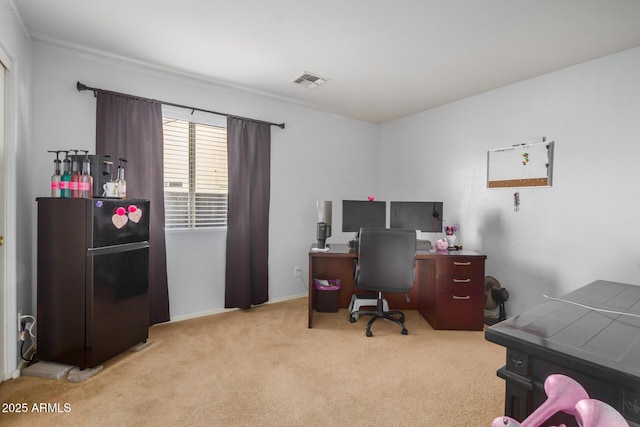 home office featuring visible vents and light carpet