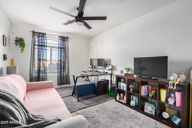 living room featuring a ceiling fan and carpet floors