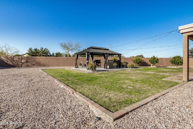 view of yard with a gazebo, a patio, and a fenced backyard