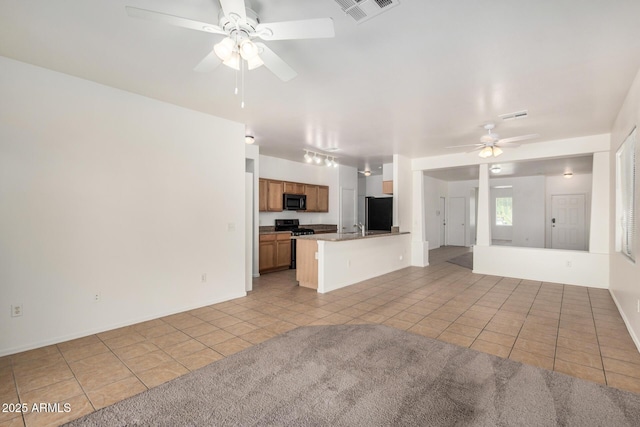 1501 S 122nd Ave, Avondale, AZ 85323 - unfurnished living room with light tile patterned floors and ceiling fan