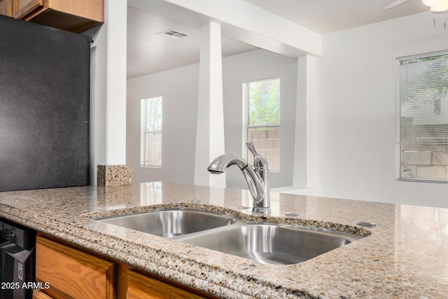 1501 S 122nd Ave, Avondale, AZ 85323 - kitchen with light stone countertops and brown cabinets