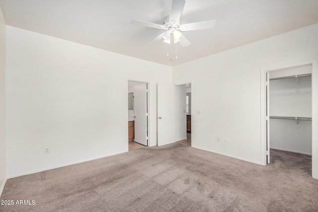 1501 S 122nd Ave, Avondale, AZ 85323 - unfurnished bedroom with light colored carpet, a spacious closet, connected bathroom, a closet, and ceiling fan