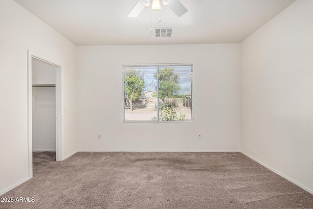 1501 S 122nd Ave, Avondale, AZ 85323 - unfurnished bedroom with carpet flooring, a spacious closet, a closet, and a ceiling fan