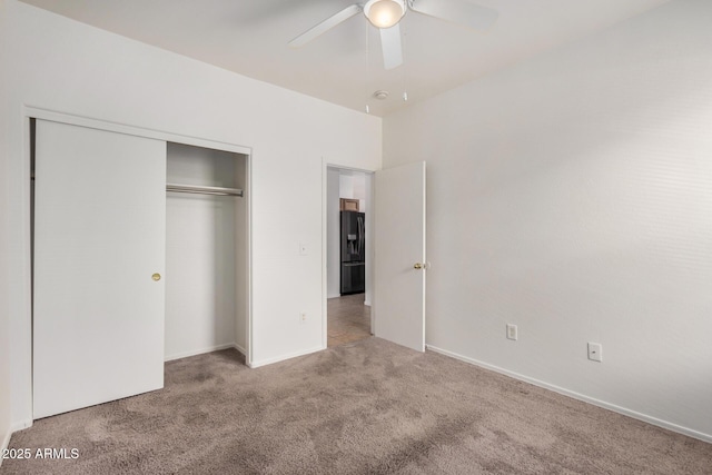 1501 S 122nd Ave, Avondale, AZ 85323 - unfurnished bedroom with carpet floors, black fridge with ice dispenser, a closet, and a ceiling fan