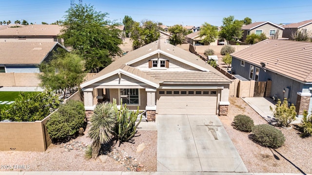 1501 S 122nd Ave, Avondale, AZ 85323 - view of front of home with stone siding, driveway, a garage, a residential view, and covered porch