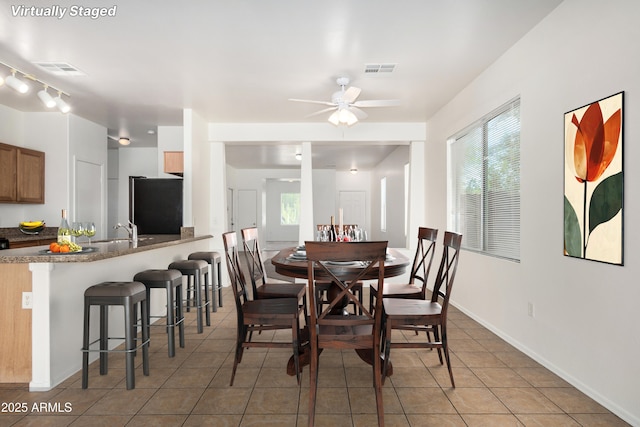 1501 S 122nd Ave, Avondale, AZ 85323 - dining area with ceiling fan and light tile patterned flooring