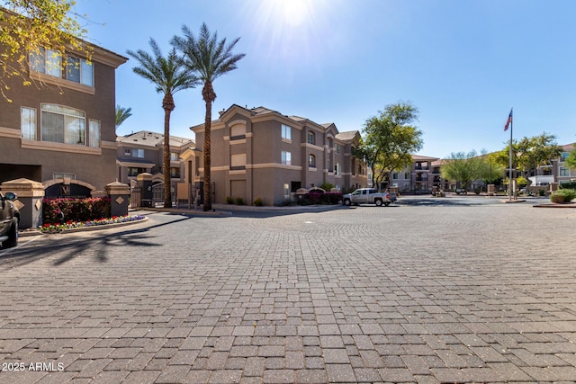 view of street with curbs and a residential view