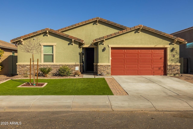 view of front of property featuring a garage and a front yard